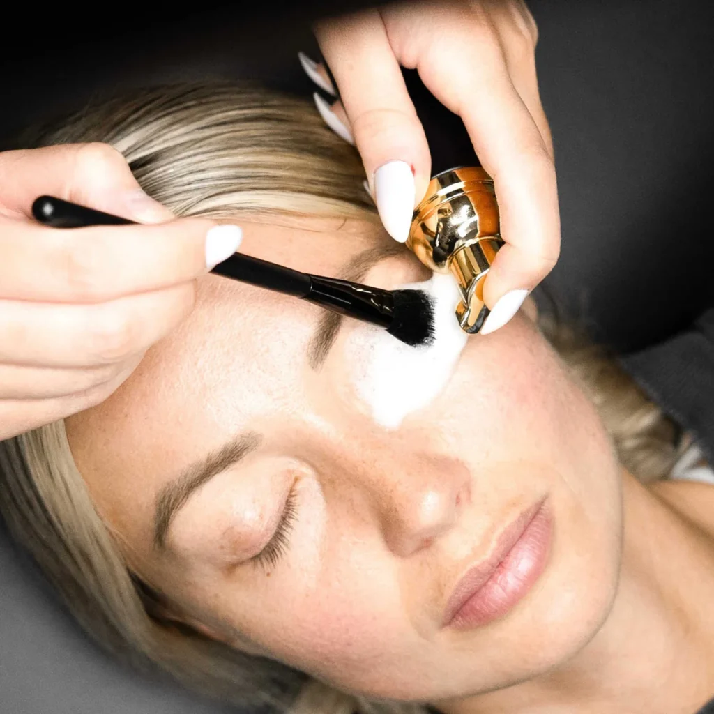 Close-up of gentle cleansing for eyelids demonstrating lash extension aftercare